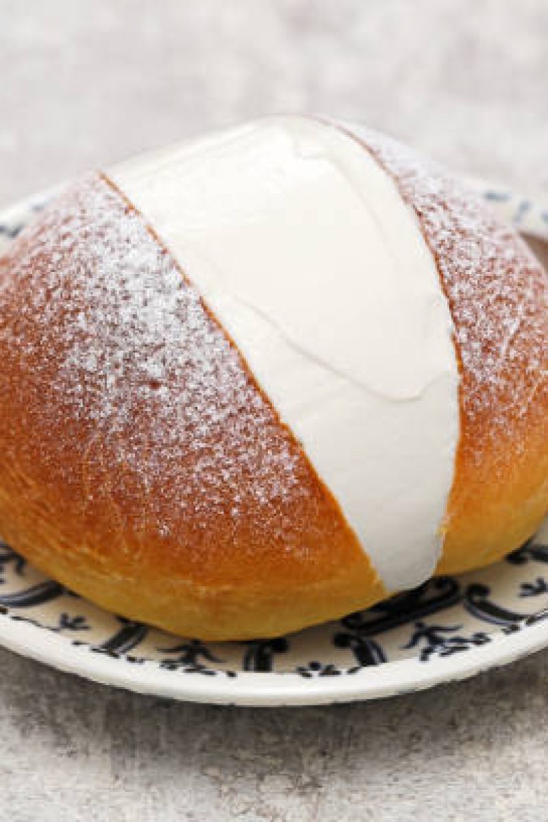 Maritozzo is italian roman breakfast sweet that whipped cream sandwiched between brioche.
